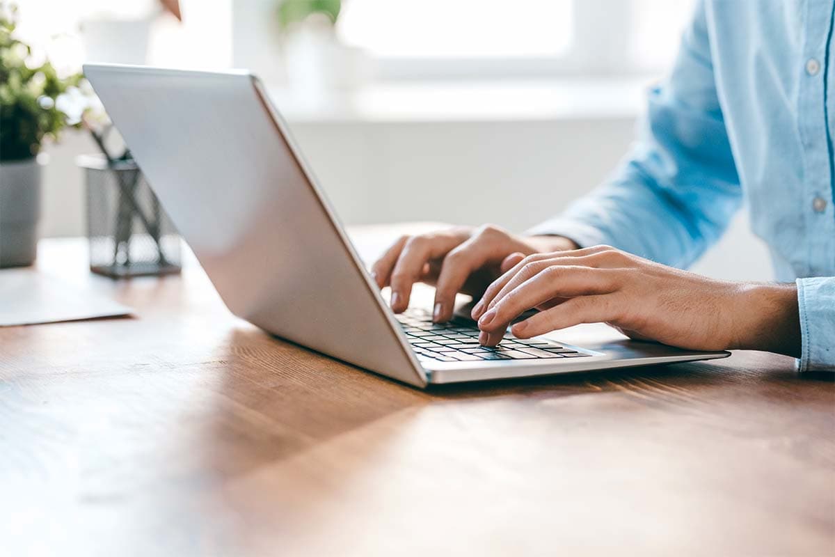 Typing on a laptop