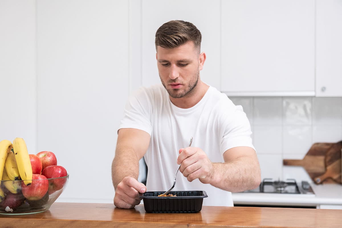 Jai Arrow eating a my muscle chef meal